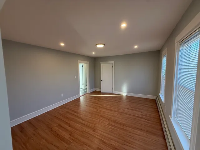a view of room with hardwood floor