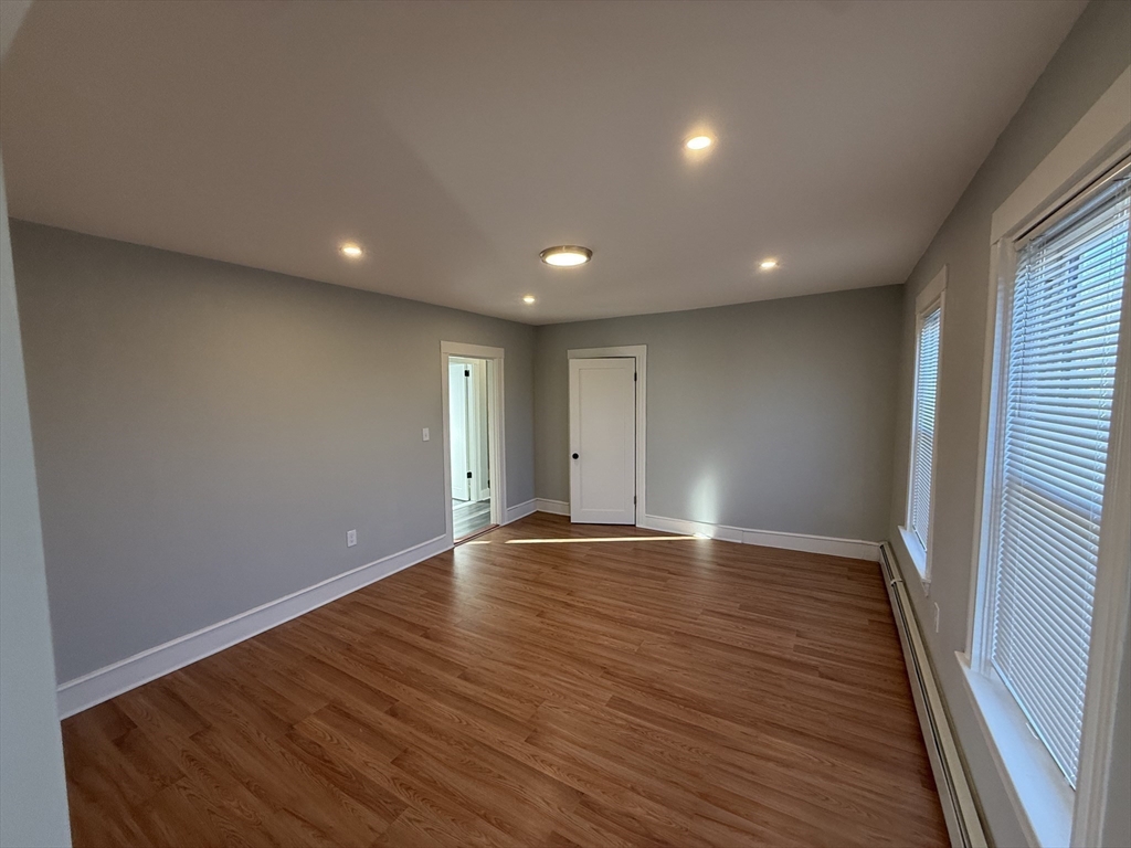 1922 Columbus Avenue, Unit 2 Boston, MA 02119 - Photo 5 of 22 a view of room with hardwood floor