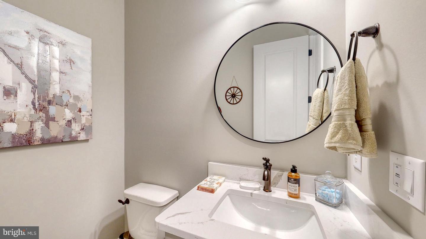 3 William Street Georgetown, DE 19947 - Photo 14 of 25 a bathroom with a sink and a mirror