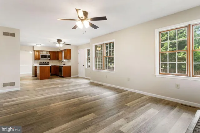 a view of livingroom with furniture window and wooden floor