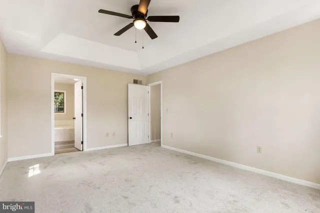 a white bath tub sitting in a bathroom