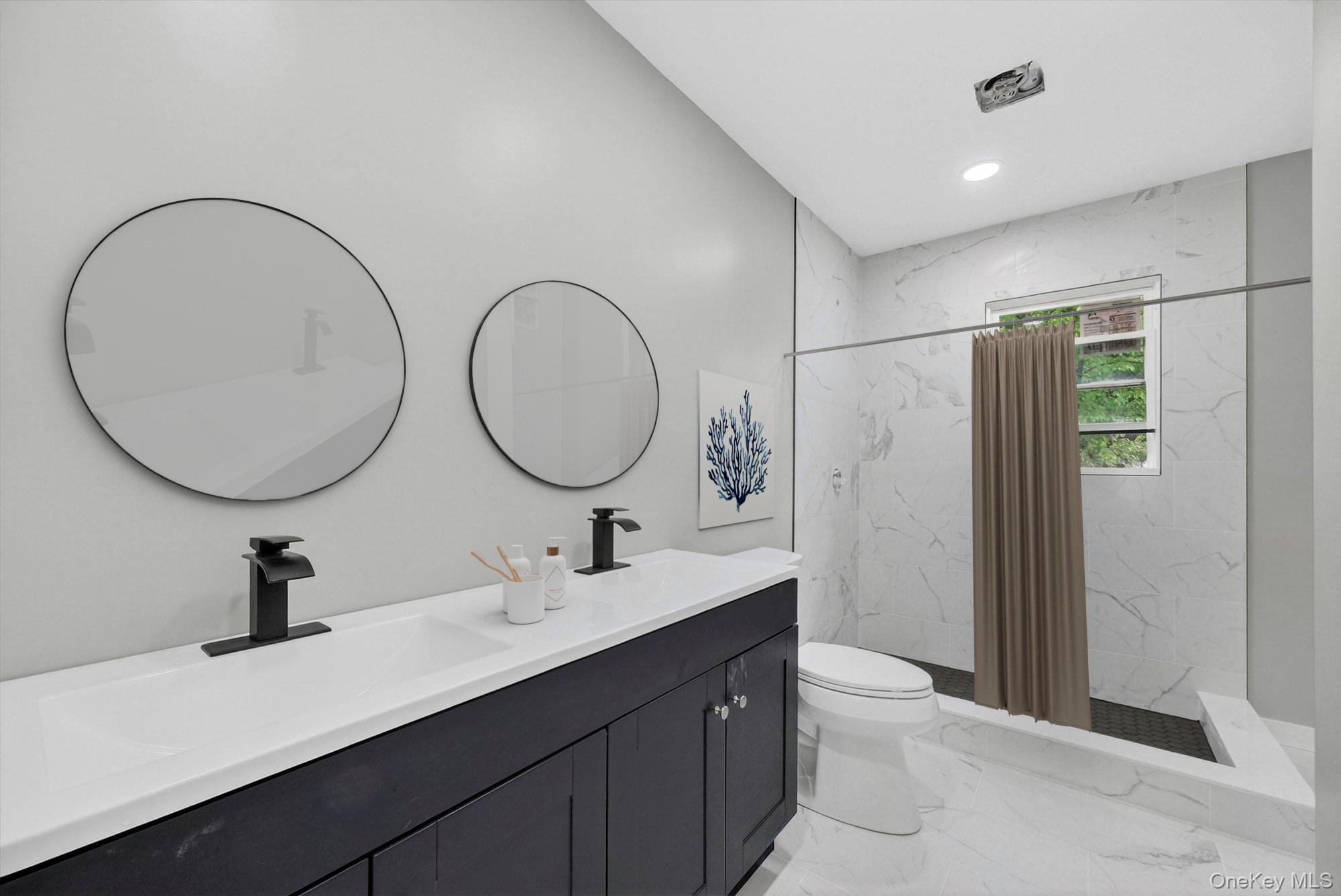 8 Mockingbird Lane Poughkeepsie, NY 12601 - Photo 11 of 32 a bathroom with a double vanity sink and a mirror