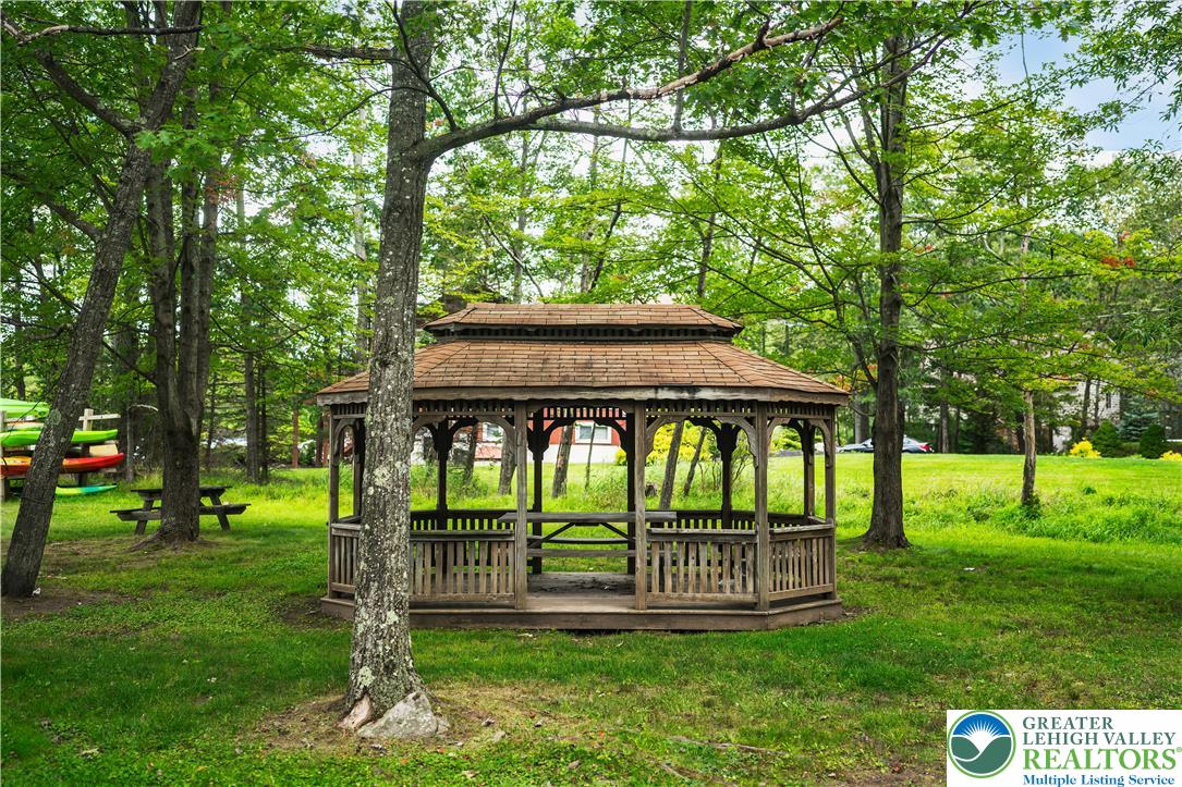 804 Evergreen Road Tobyhanna, PA 18466 - Photo 18 of 19 a view of a deck with a big yard and large trees