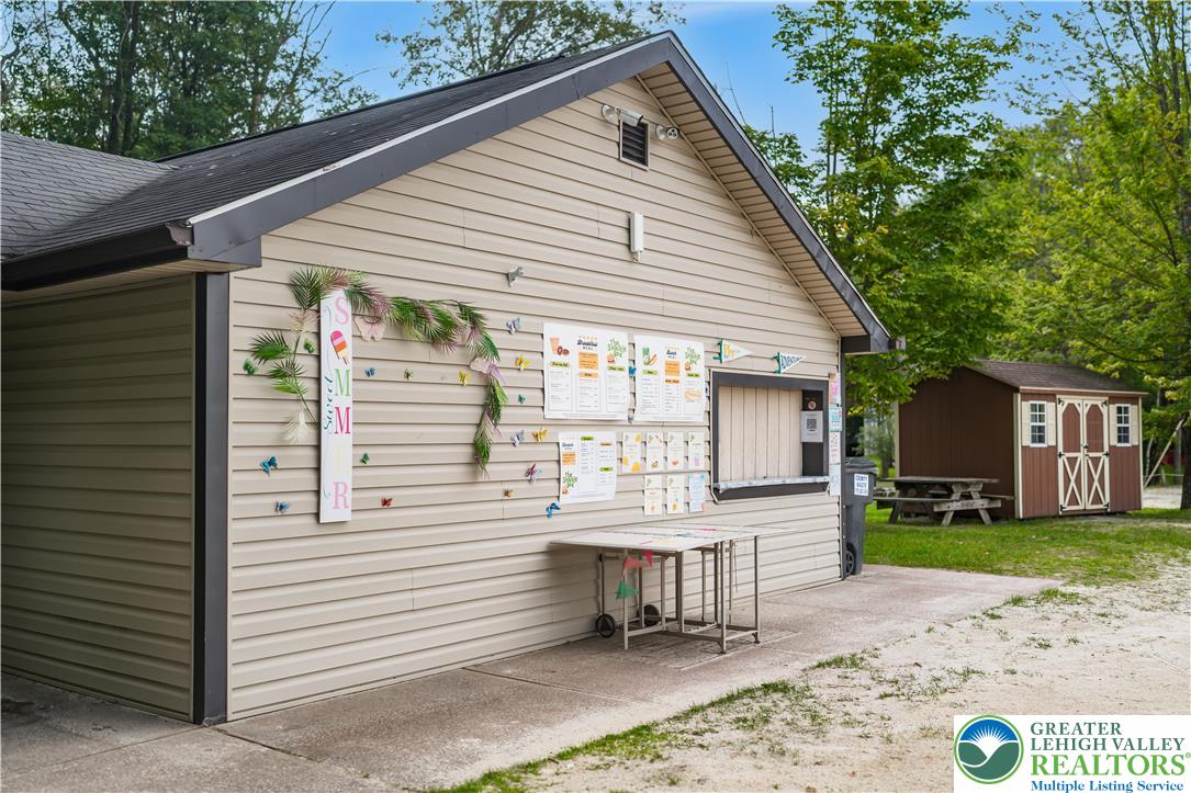 804 Evergreen Road Tobyhanna, PA 18466 - Photo 19 of 19 a view of a dinning table and chairs in patio of the house