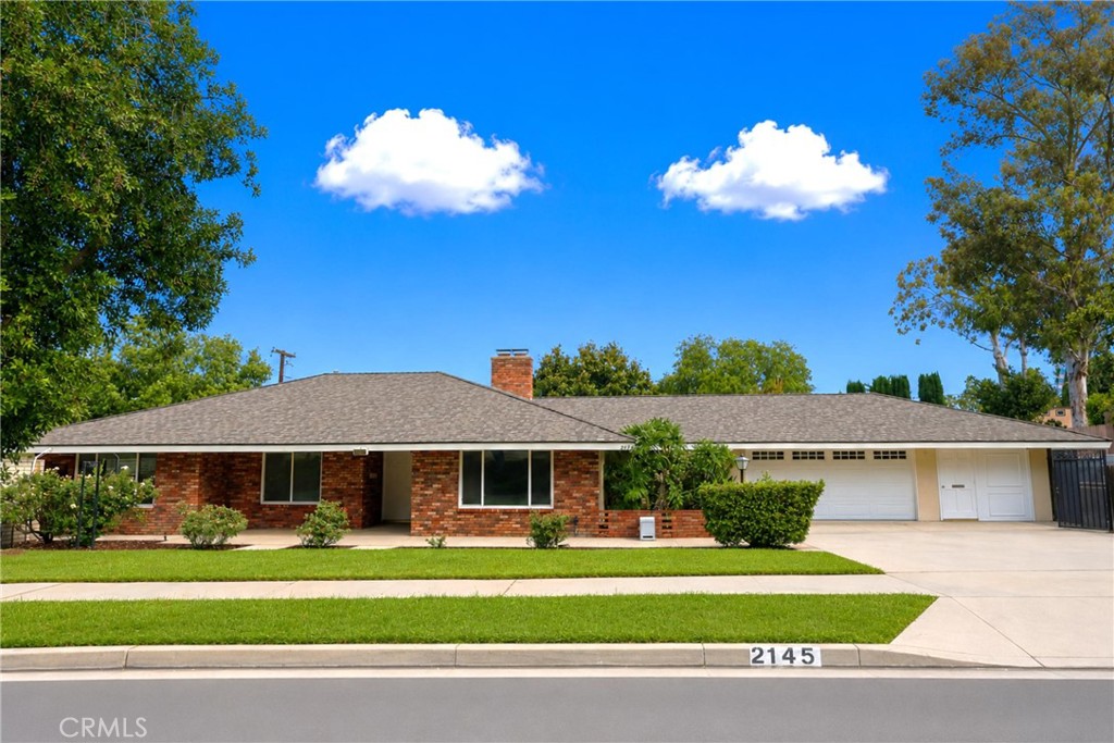 2145 Fairview Avenue Riverside, CA 92506 - Photo 2 of 35 a front view of a house with a garden