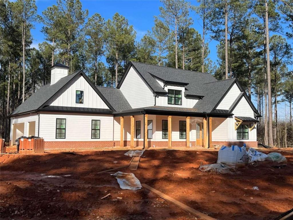 a view of house with yard