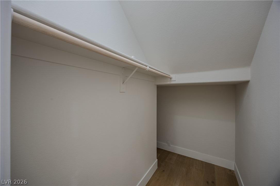 8800 Lusso Las Vegas, NV 89134 - Photo 76 of 85 Walk in closet with light wood finished floors