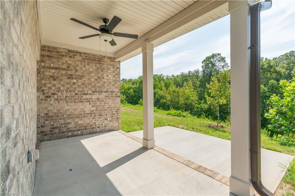 2059 Welden Ridge Road Kernersville, NC 27284 - Photo 8 of 50 Back Porch overlooking the beautiful tree line.