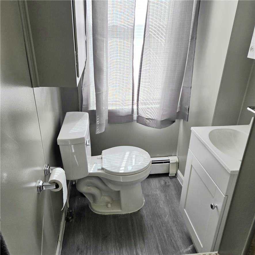 10 Barto Road Barto, PA 19504 - Photo 17 of 17 A window brings natural light into this bathroom featuring durable wood-look flooring.