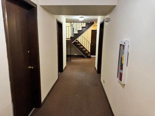 a view of a hallway with staircase