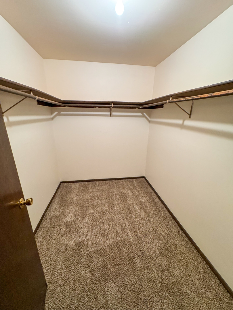 5500 West 127th Street, Unit 4 Alsip, IL 60803 - Photo 12 of 15 a view of a room with racks on the wall