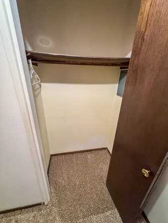 a view of a kitchen with fridge and furniture