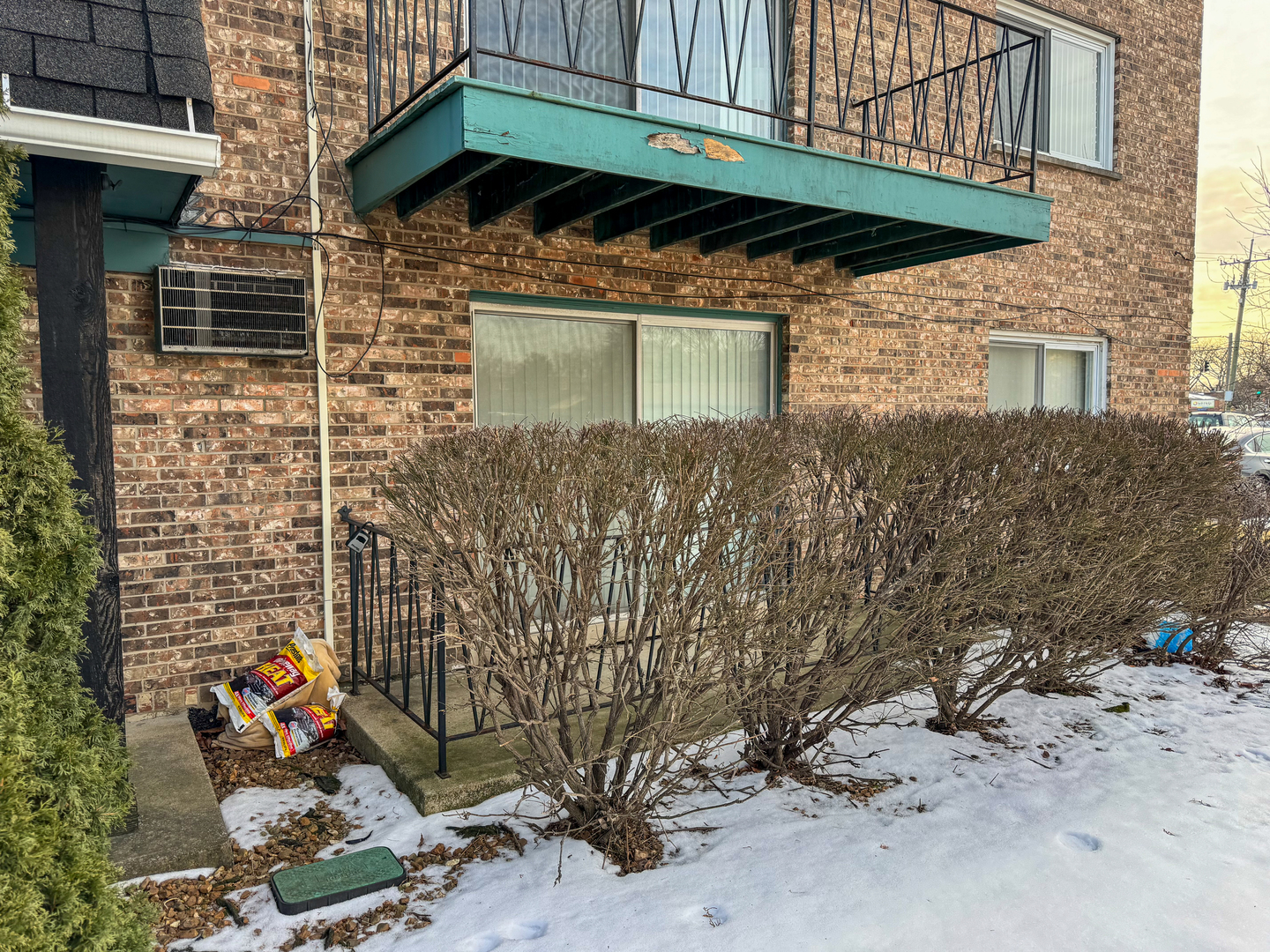 5500 West 127th Street, Unit 4 Alsip, IL 60803 - Photo 2 of 15 a view of a wooden door with a bench