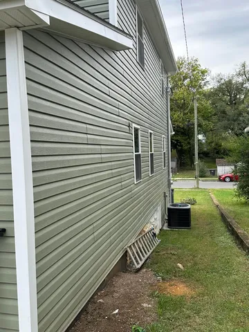 a view of a backyard with sitting area