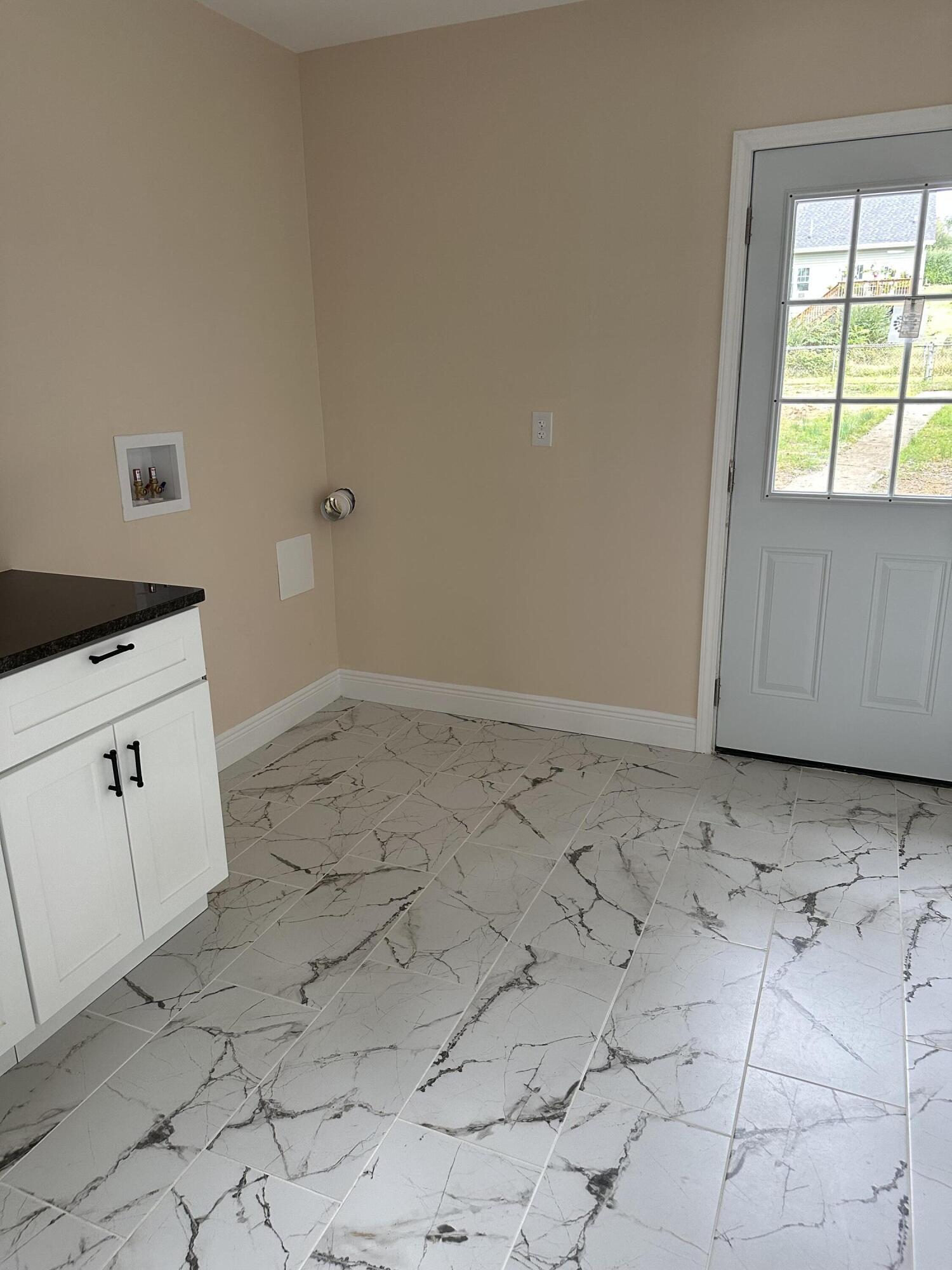707 Rutherford Avenue Northwest Roanoke, VA 24016 - Photo 9 of 22 a view of a kitchen with white cabinets