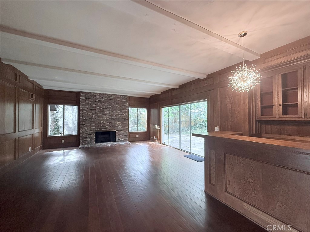 1727 Euston Road San Marino, CA 91108 - Photo 12 of 36 an empty room with wooden floor and fireplace