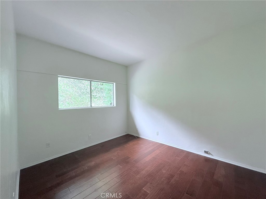 1727 Euston Road San Marino, CA 91108 - Photo 14 of 36 an empty room with wooden floor and windows