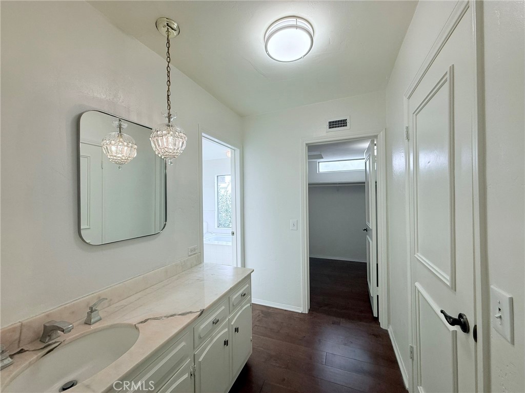 1727 Euston Road San Marino, CA 91108 - Photo 20 of 36 a bathroom with a double vanity sink and a mirror