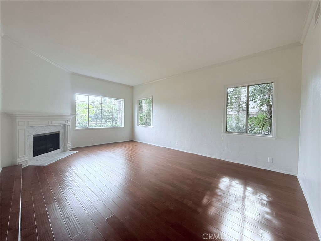 1727 Euston Road San Marino, CA 91108 - Photo 2 of 36 a view of an empty room with wooden floor and a window