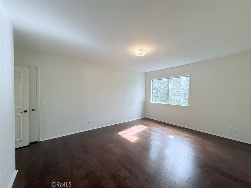 1727 Euston Road San Marino, CA 91108 - Photo 27 of 36 an empty room with wooden floor and windows