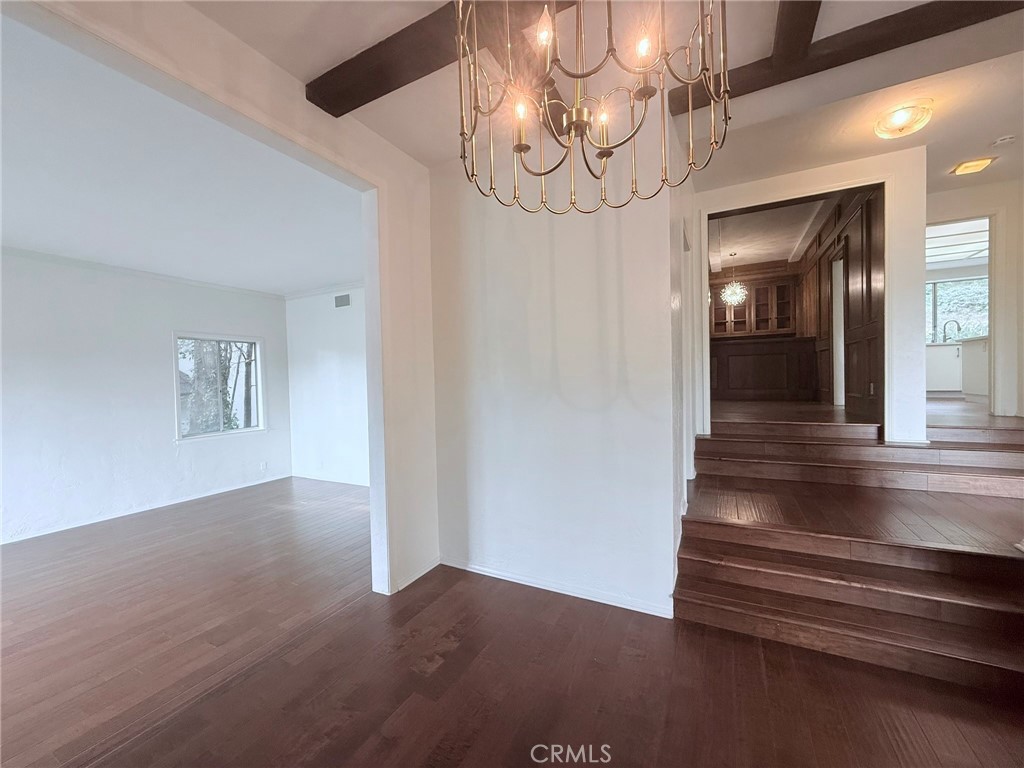1727 Euston Road San Marino, CA 91108 - Photo 5 of 36 a view of a hallway with wooden floor and chandelier