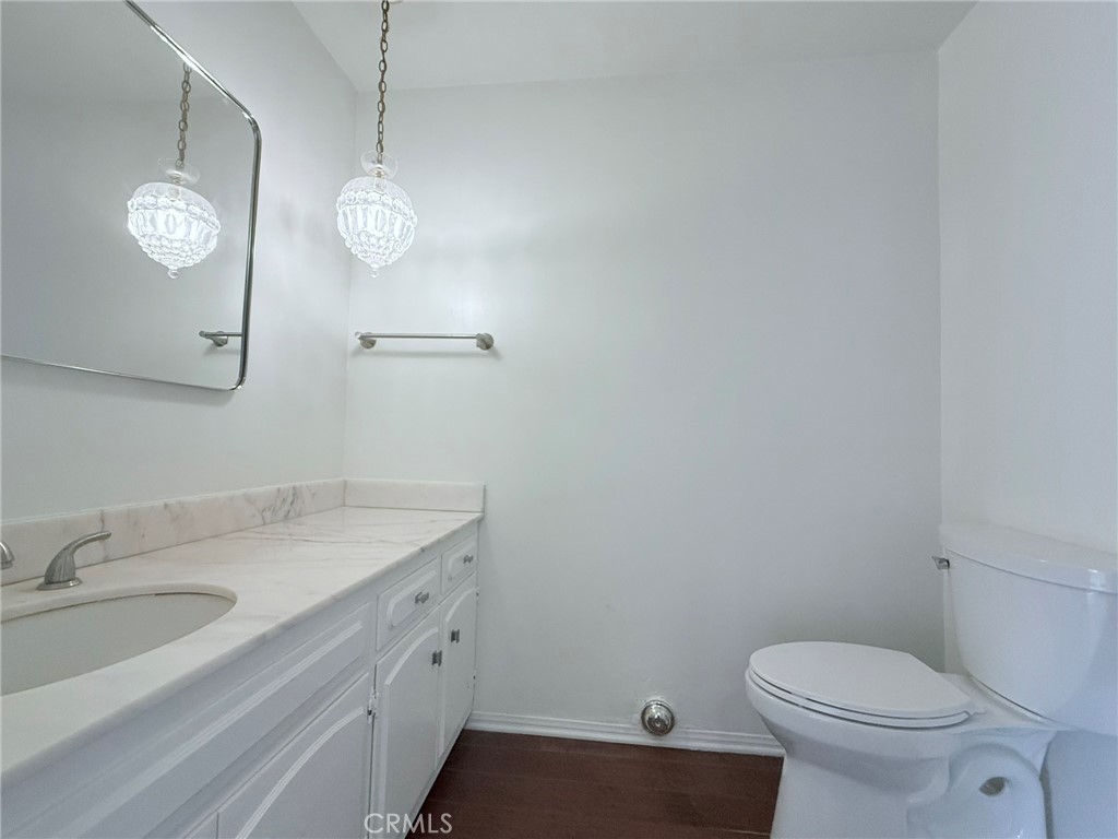 1727 Euston Road San Marino, CA 91108 - Photo 7 of 36 a bathroom with a sink a toilet and a large mirror