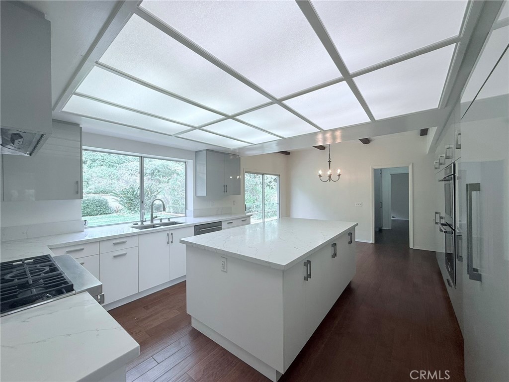 1727 Euston Road San Marino, CA 91108 - Photo 10 of 36 a large white kitchen with a large window