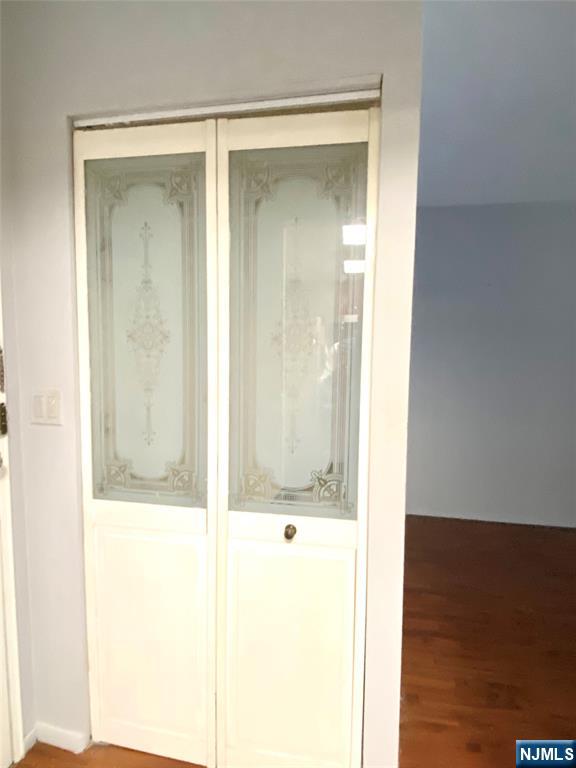 1111 River Road, Unit H21 Edgewater, NJ 07020 - Photo 4 of 8 a bathroom with a glass shower door