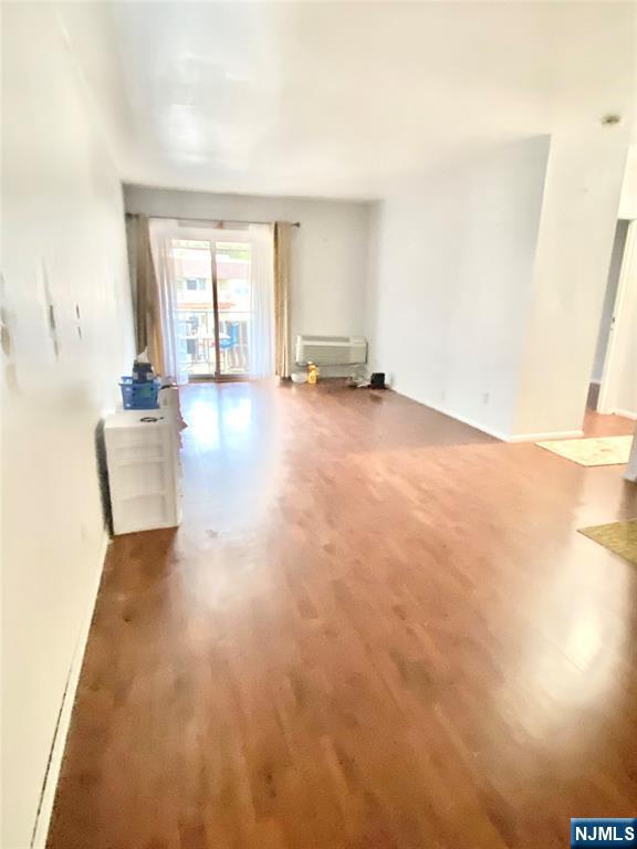 1111 River Road, Unit H21 Edgewater, NJ 07020 - Photo 6 of 8 a view of an empty room with a window