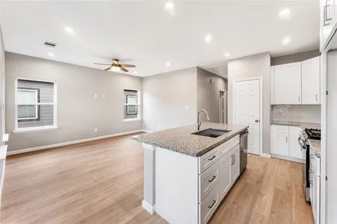 a kitchen with a stove and a sink