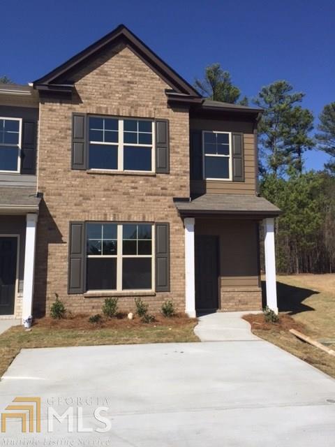 1808 Broad River Road, Unit 18F Atlanta, GA 30349 - Photo 1 of 1 a front view of a house with a yard and garage