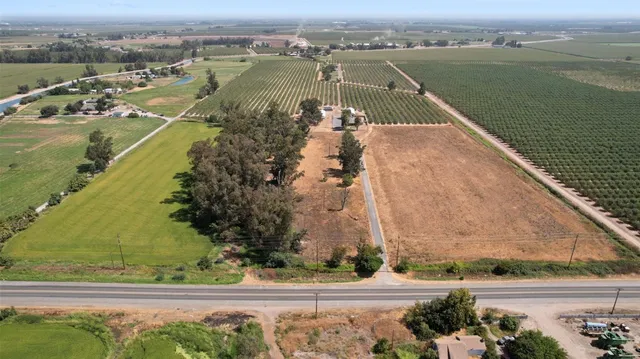 an aerial view of a residential houses with outdoor space