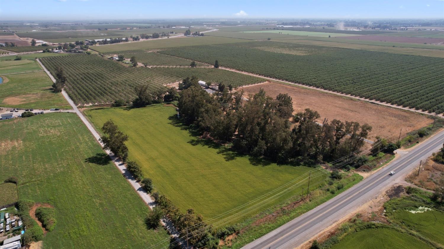 0 Claus Road Modesto, CA 95357 - Photo 5 of 20 a view of a lake with a yard and large trees