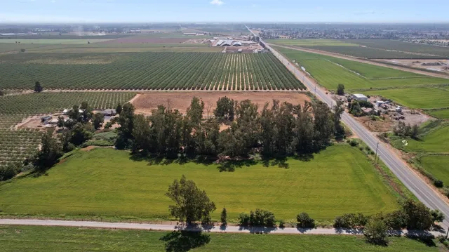 a view of a lake with a yard