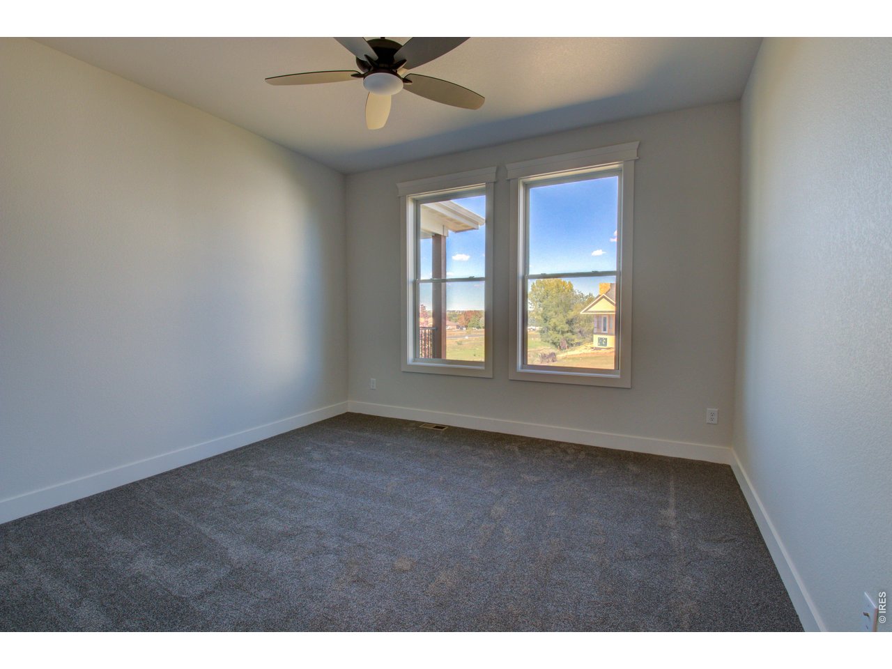 5705 2nd Road Greeley, CO 80634 - Photo 30 of 46 The second bedroom, which also has upgraded carpeting is located near the full main bath and the laundry/mudroom