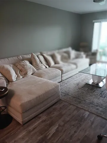 a bedroom with a bed and a night stand