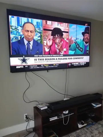 a view of a balcony with chairs and wooden floor