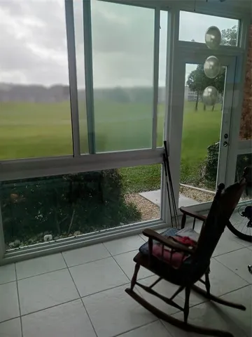 a kitchen with granite countertop a refrigerator and a sink