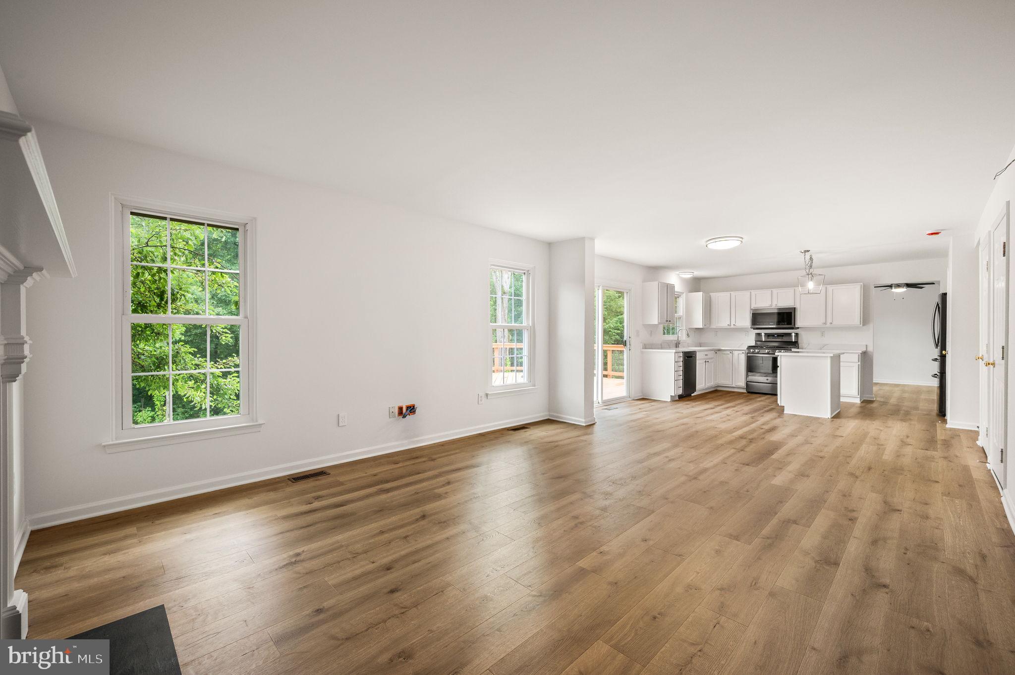 420 Winding Stream Road Spring City, PA 19475 - Photo 17 of 45 a view of empty room with wooden floor and windows
