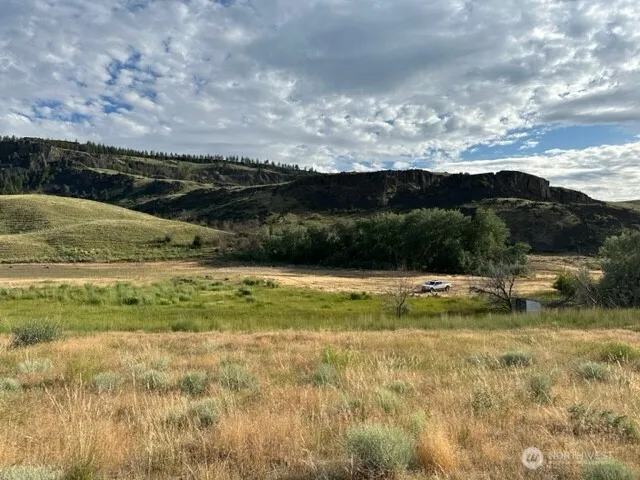 a view of a lake with a big yard