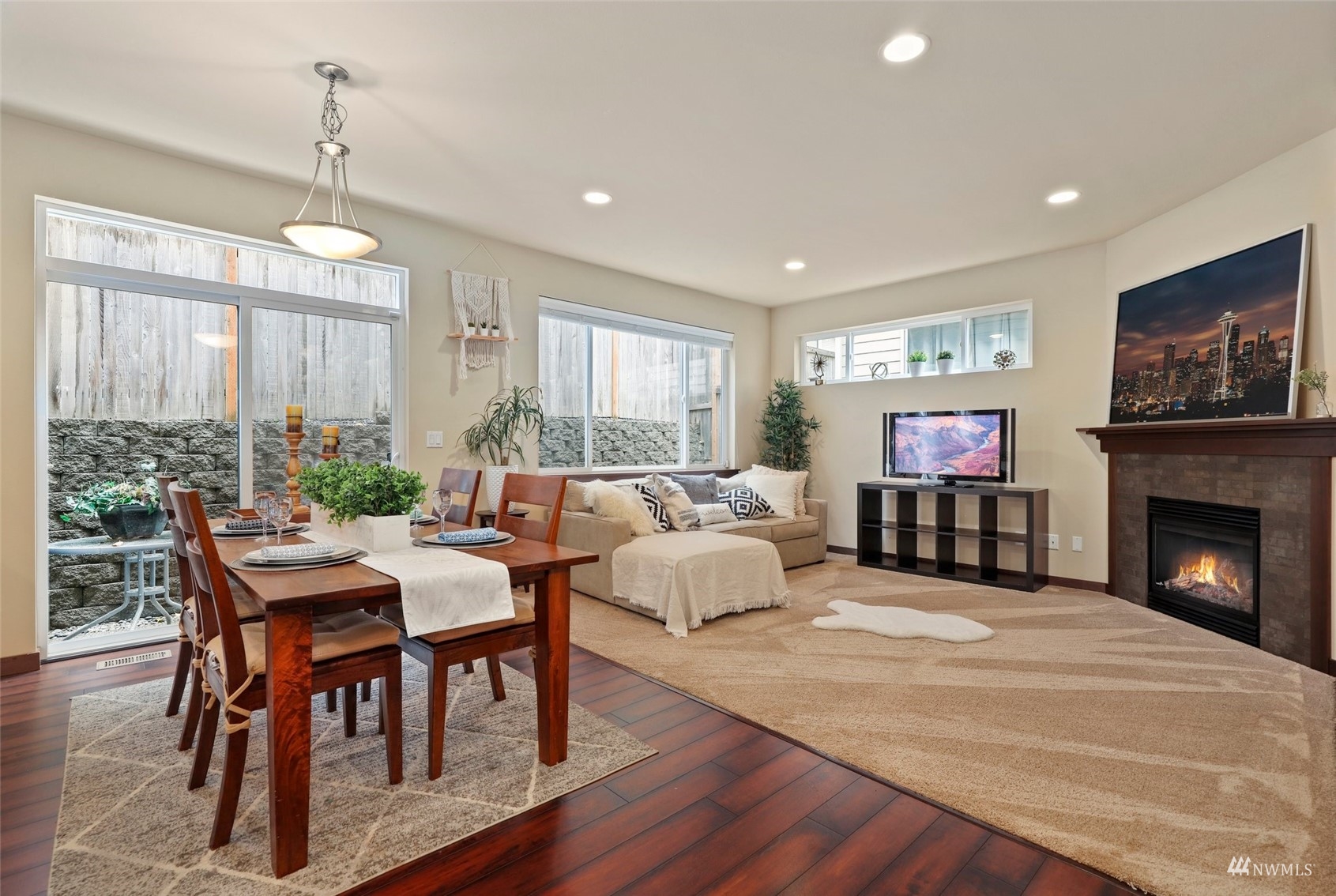 20220 3rd Drive Southeast Bothell, WA 98012 - Photo 11 of 37 a living room with furniture a fireplace and a flat screen tv