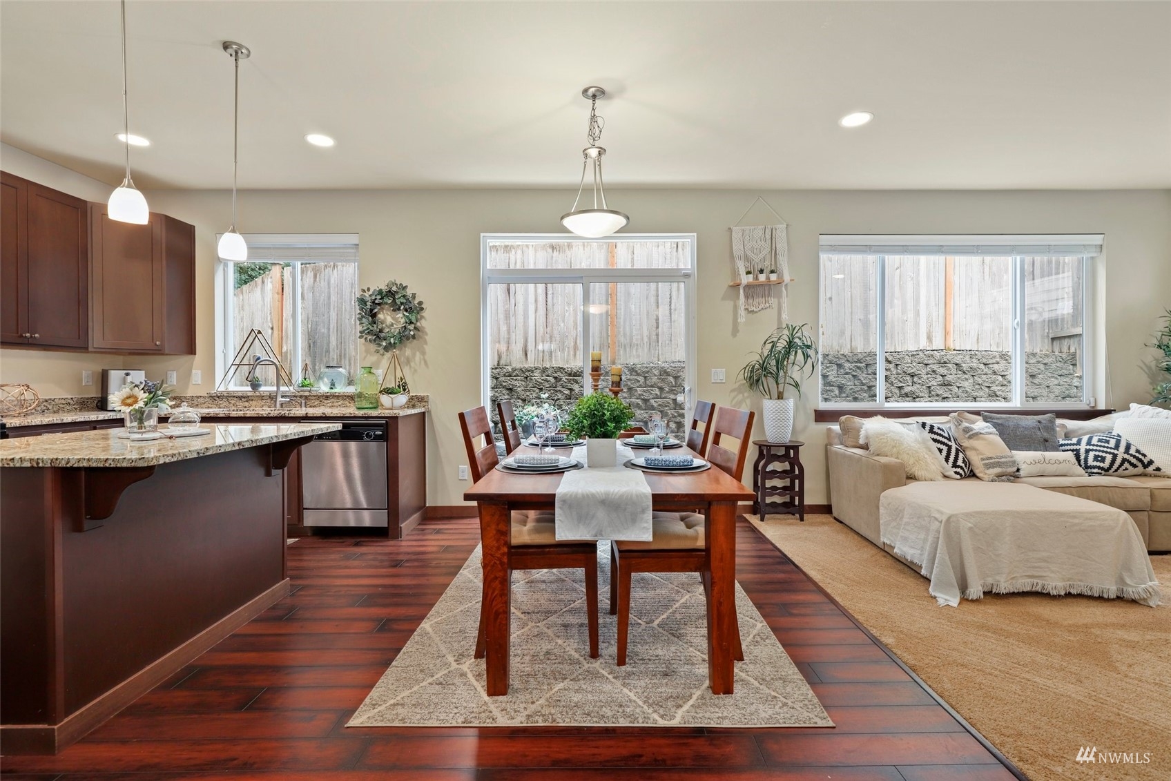 20220 3rd Drive Southeast Bothell, WA 98012 - Photo 12 of 37 a living room with furniture a large window and a chandelier