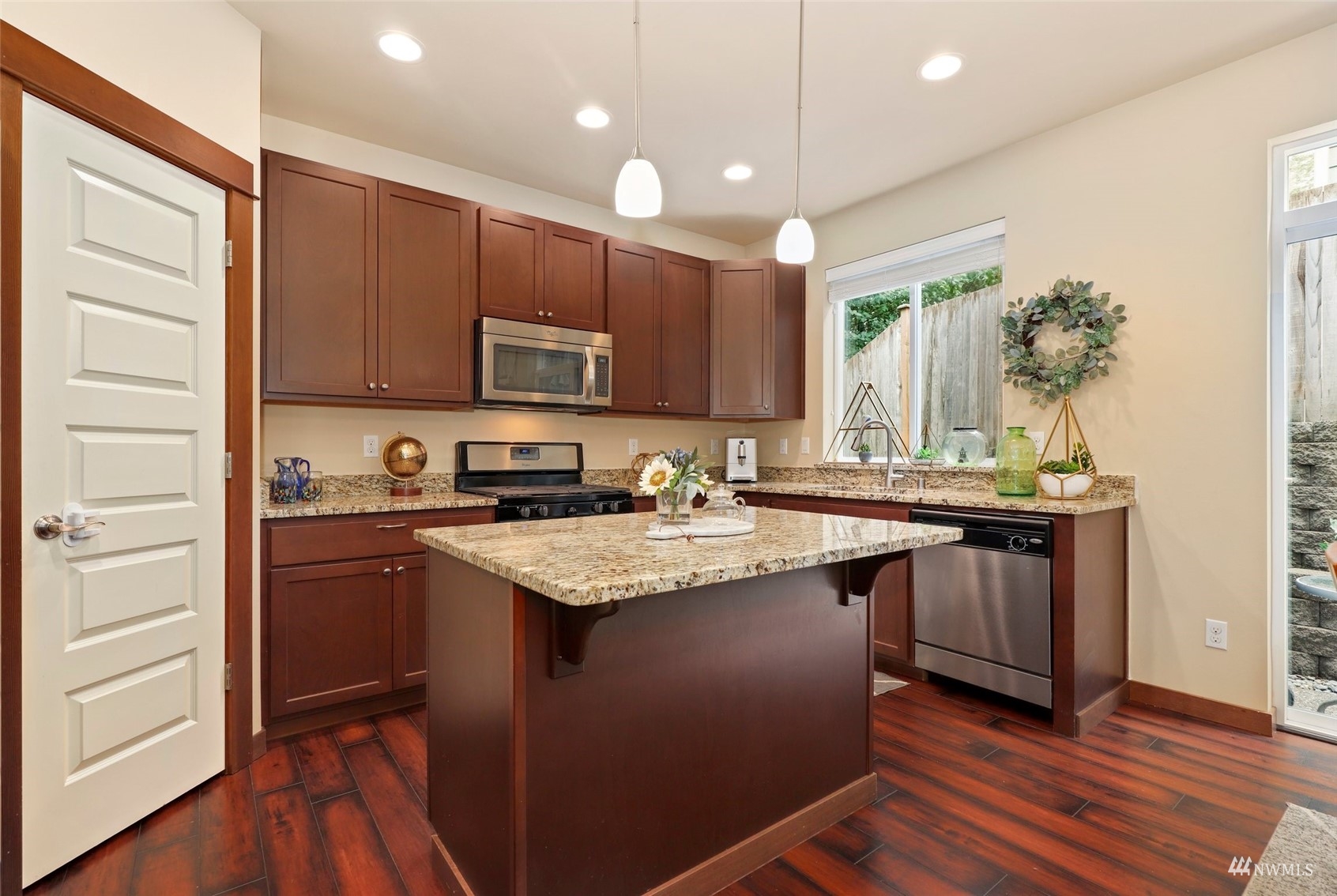 20220 3rd Drive Southeast Bothell, WA 98012 - Photo 14 of 37 a kitchen with stainless steel appliances granite countertop a sink stove and refrigerator