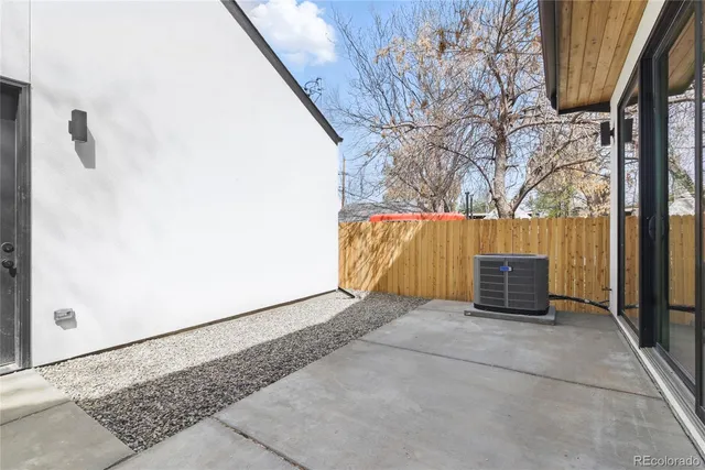 a view of an outdoor space with wooden fence