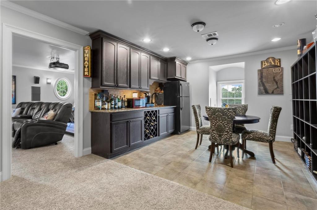 285 Old Hornage Road Ball Ground, GA 30107 - Photo 45 of 64 a living room with stainless steel appliances kitchen island granite countertop furniture and a view of kitchen