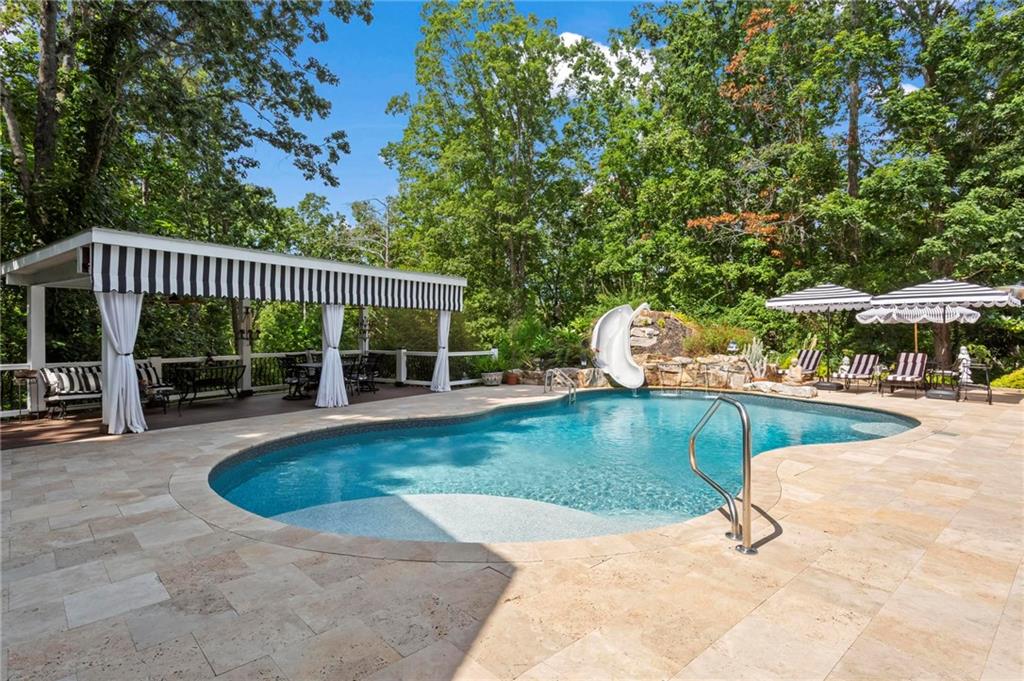 285 Old Hornage Road Ball Ground, GA 30107 - Photo 5 of 64 a view of a swimming pool with a patio
