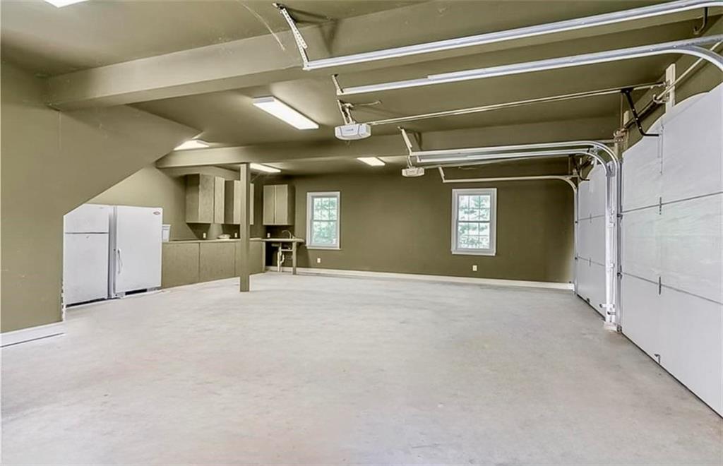 285 Old Hornage Road Ball Ground, GA 30107 - Photo 59 of 64 a view of a livingroom with a staircase