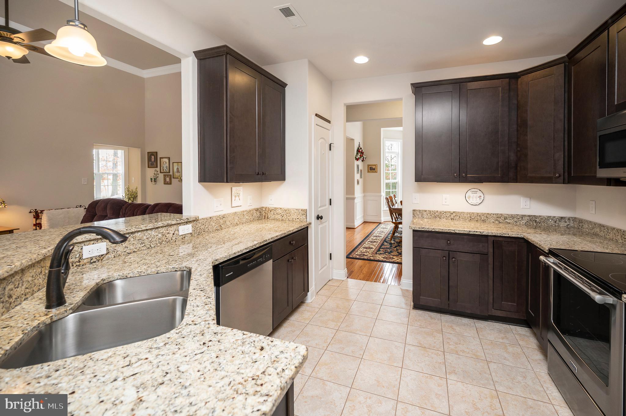 23145 Walker's Branch Road Unionville, VA 22567 - Photo 13 of 48 a kitchen with a sink stove top oven and cabinets