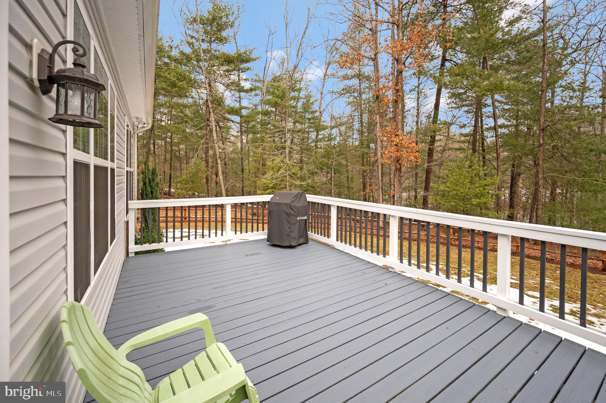 23145 Walker's Branch Road Unionville, VA 22567 - Photo 20 of 48 a view of a balcony with wooden floor and fence