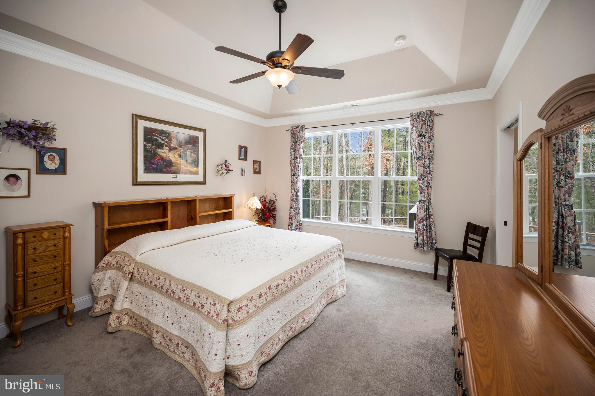 23145 Walker's Branch Road Unionville, VA 22567 - Photo 24 of 48 a bed sitting in a bedroom next to a window